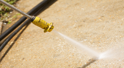 power washing a sidewalk